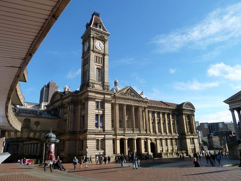 front view of the old birmingham museum and art gallery building with the clock tower on top, in the heart of birmingham city centre, england