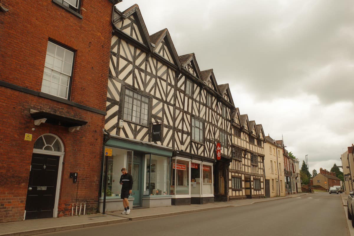 a street lined with 16th century timber framed buildings