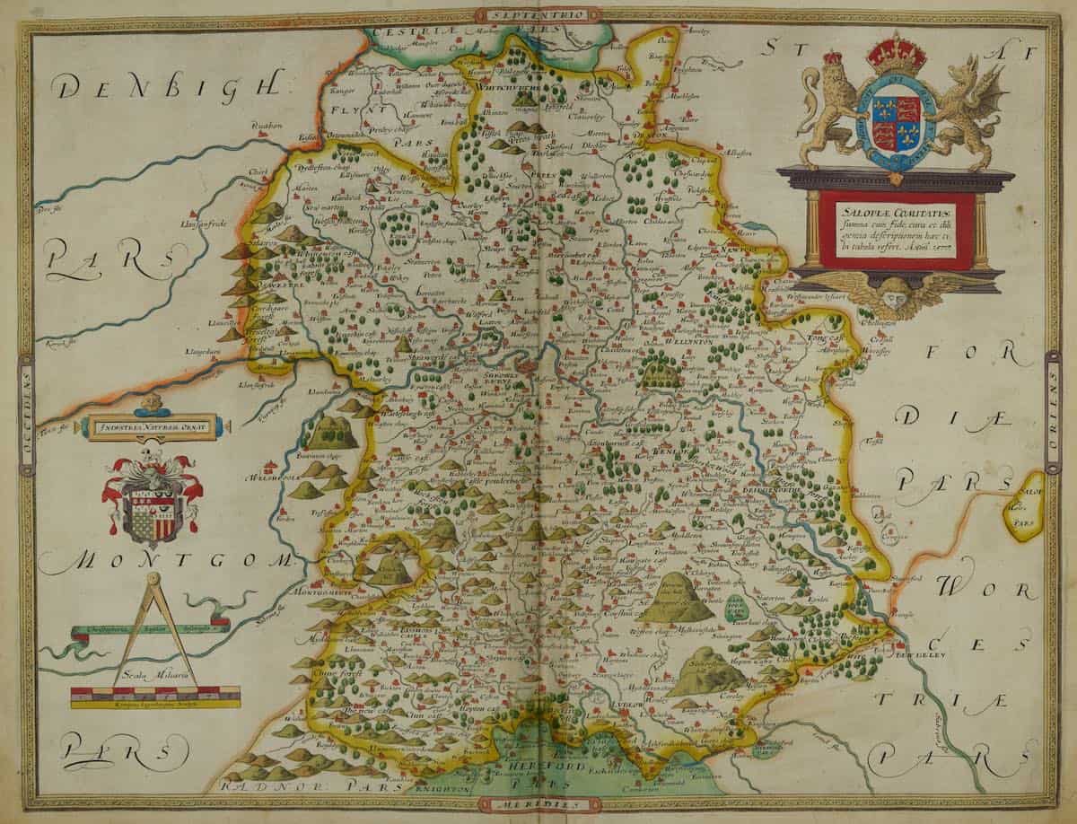 a vintage map of shropshire county dated from medieval times, named "salopia" the medieval name of shropshire. yellow border outlines the county, geographcal images surround the map while featured are intricate detailed hills, rivers, roads and markers of old place names in shropshire.